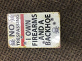 No Trespassing Sign - Firearms and Backhoe Warning